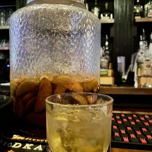 a drink in front of a pitcher