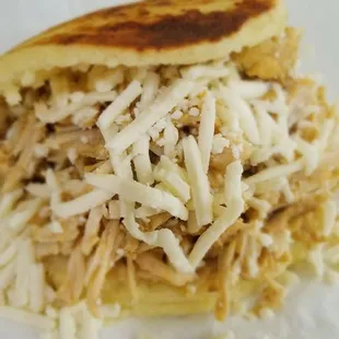 Arepa stuffed with our specialty braised chicken