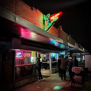a neon sign for a restaurant
