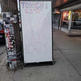 a sign on the side of a street