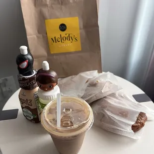 Iced soy vanilla latte, juice &amp; chocolate milk, 2 croissants and a cheese danish.