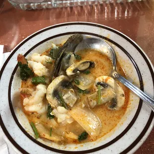 a bowl of soup with a spoon in it