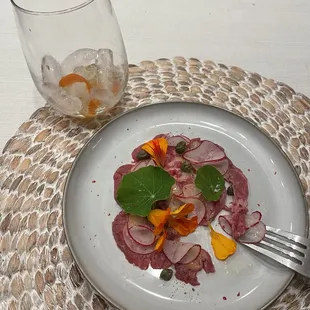 Beet carpaccio with horseradish creme, pink peppercorn, watercress &amp; flowers