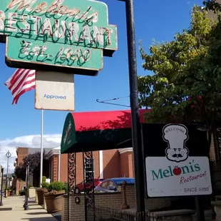 Meloni's est. 1950. Stairs lead up to restaurant.