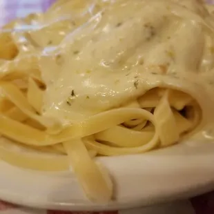 A side of fettuccini alfredo. I think this sauce is made in house as it includes bits of fresh garlic. Tasty.