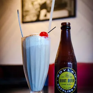 a milkshake and a bottle of root beer