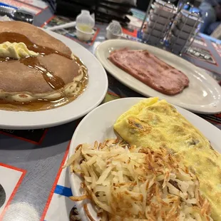 Breakfast. All meats omelette with hash browns and a side ham and hot cake. All good.
