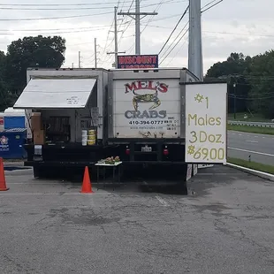 a delivery truck parked on the side of the road