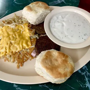 Biscuits and gravy with loaded hash browns.