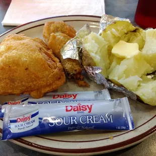 Broasted chicken with baked potato.