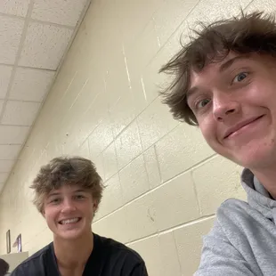 two boys sitting at a table