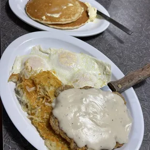 Chicken fried steak, hash browns, eggs over-easy, pancakes I read of toast