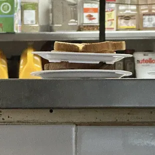 They stack plates on top of food serving.  How is this sanitary.