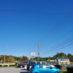 a blue car parked in a parking lot