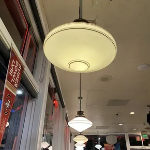 a restaurant with a ceiling light