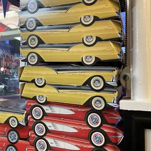 Sitting next to a stack of cars