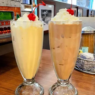two milkshakes on a table