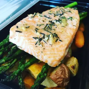 Cajun, garlic and herb butter salmon with asparagus and roasted potatoes