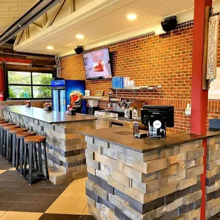 a bar with a television on the wall