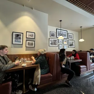 people sitting at a table in a restaurant