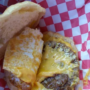 a cheeseburger in a basket