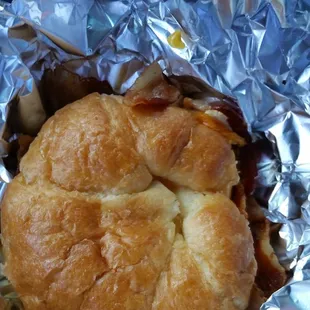 a croissant sandwich wrapped in foil