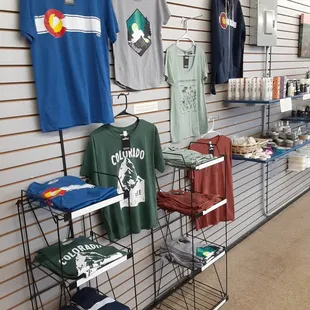 a variety of t - shirts on display