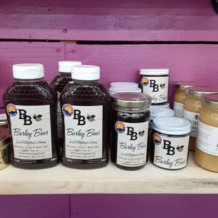a variety of jams on a shelf