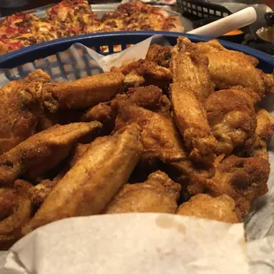 a basket of chicken wings