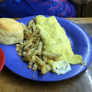 Western omelette with fries, biscuit and gravy