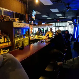 people sitting at the bar