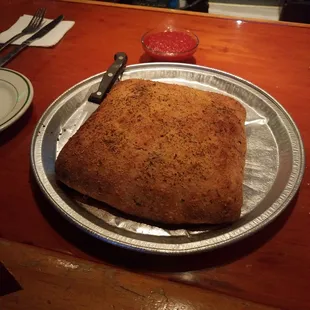 Yes that's a pizza tray - and that there is a stromboli! Wednesday rocks at Mel's!!