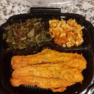 Fried catfish, macaroni and cheese and collard greens.