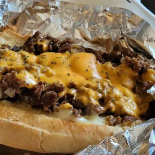 Cheese steak with American cheese, fried onions extra mayo.