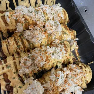 a plate of waffles covered in cheese and sauce