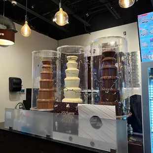 a display of chocolate covered desserts