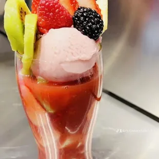 a strawberry, kiwi, kiwi, kiwi, kiwi, kiwi, kiwi, kiwi