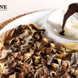a plate of food and a bowl of ice cream