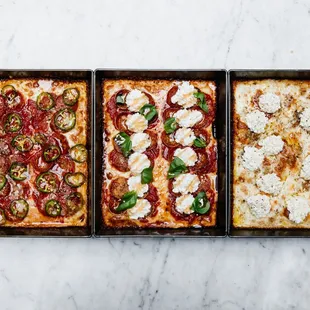 three different types of pizza