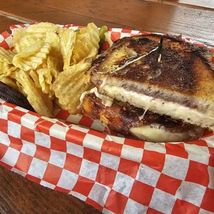a sandwich and chips in a basket