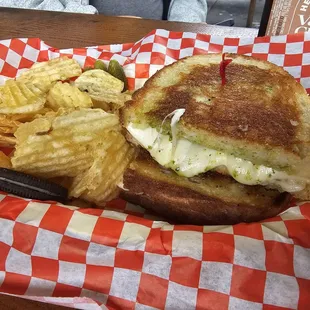 a grilled cheese sandwich and potato chips