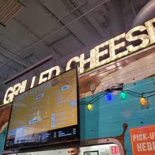 a sign for a cheese shop