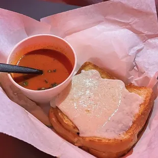 Raclette with truffle oil and a side of tomato soup at AREA15