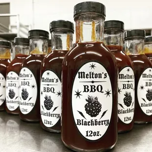 a row of bottles of bbq sauce