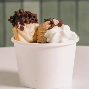Italian cookies, coffee ice cream and whipped cream, served in a cup.