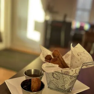 Churros with blueberry compote and caramel