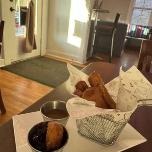 Churros with blueberry compote and caramel