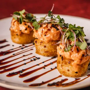 two appetizers on a white plate