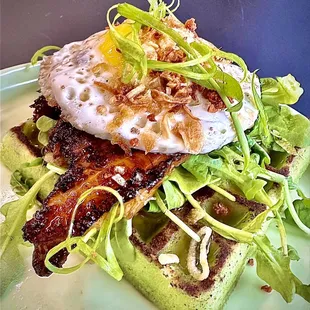 Đặc Biệt Waffle (gf) $17 fish sauce bacon, arugula pandan waffle, fried egg* spicy syrup, fried garlic