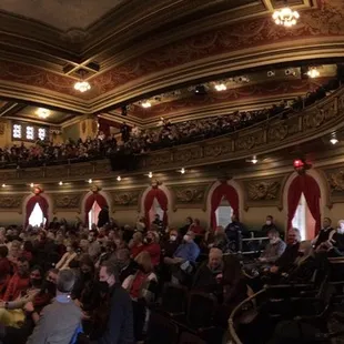 a large crowd of people in a hall
